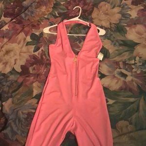 Never worn!! Tag on, Pink pants romper!!